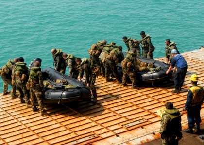 US Navy 100202-N-6692A-088 Marines assigned to the 31st Marine Expeditionary Unit (31st MEU) prepare to launch combat rubber raiding craft at the well deck of the amphibious dock landing ship USS Harpers Ferry (LSD 49)