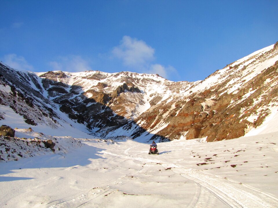 The foot snowmobile mountains