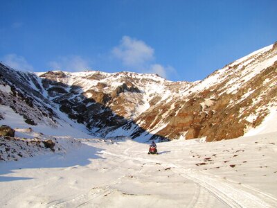 The foot snowmobile mountains photo