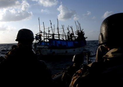 US Navy 100202-N-7088A-037 Members of the visit, board, search and seizure team stationed aboard the Arleigh Burke-class guided-missile destroyer USS Farragut (DDG 99) leave the ship to investigate a Somali skiff