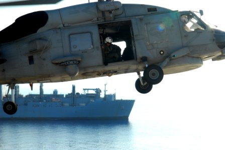 US Navy 100205-N-1092P-116 A SH-60S Sea Hawk helicopter delivers cargo