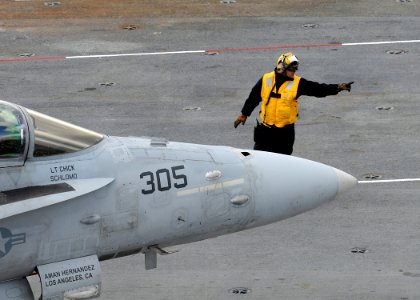 US Navy 100203-N-3885H-023 Sailor directs aircraft aboard USS George H.W. Bush photo