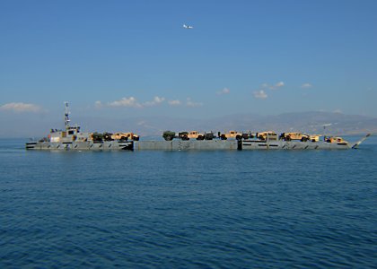 US Navy 100202-N-9643W-202 A causeway ferry from Amphibious Construction Battalion (ACB) 2 transports battalion construction vehicles and equipment to Port-au-Prince