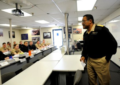 US Navy 100203-N-2259P-004 Vice Adm. D.C. Curtis, commander of Naval Surface Forces and Naval Surface Force Pacific Fleet, speaks to a group of newly commissioned officers at a surface warfare officer indoctrination class at Na photo