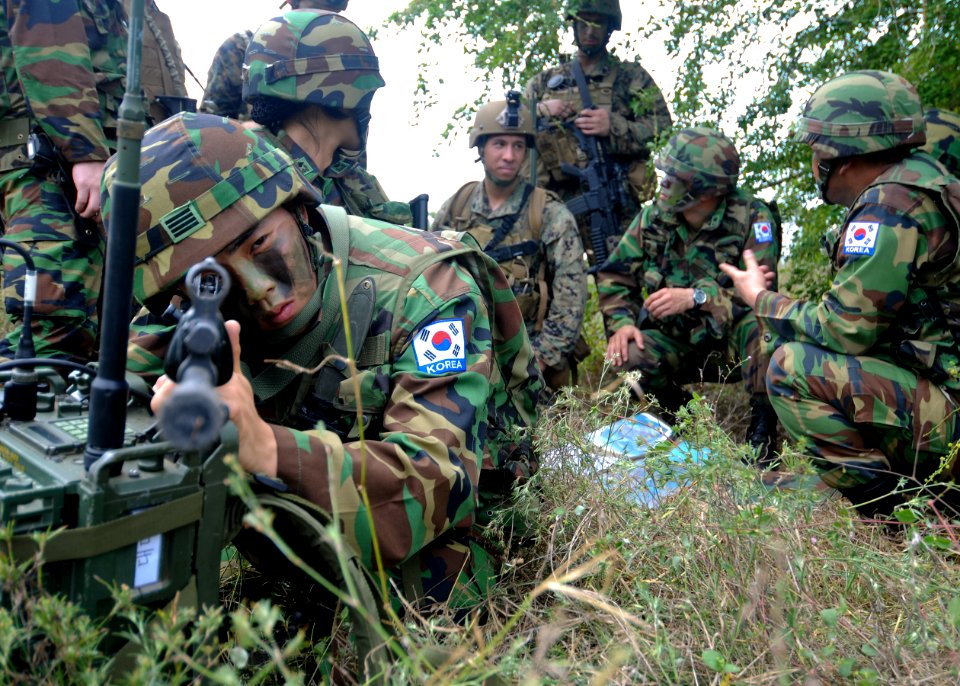 US Navy 100204-N-9950J-007 Cobra Gold 2010 participants review a map during a simulated amphibious assault photo