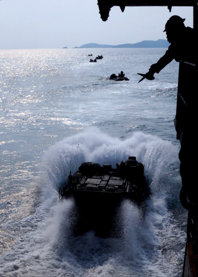 US Navy 100203-N-5538K-055 An amphibious assault vehicle from the 31st Marine Expeditionary Unit (31st MEU) exits the well deck of the forward-deployed amphibious transport dock ship USS Denver (LPD 9)