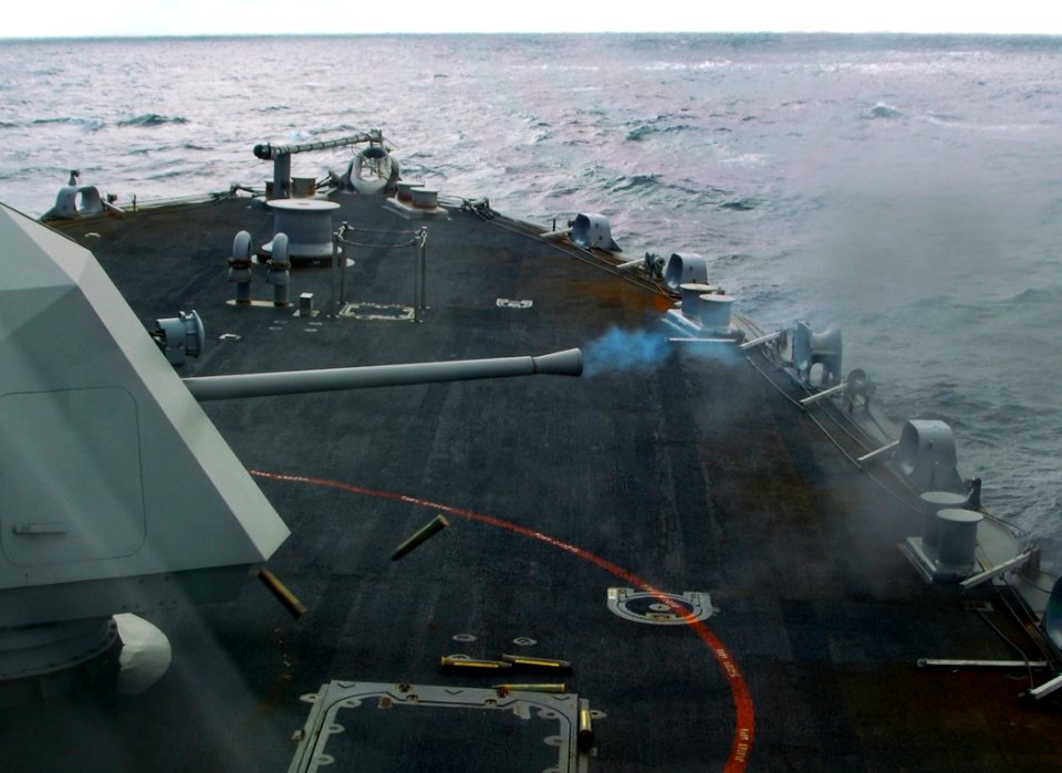 US Navy 100203-N-7058E-355 The littoral combat ship USS Freedom (LCS 1) fires multiple rounds from its Mk 110 57mm gun during combat systems testing off the Florida coast