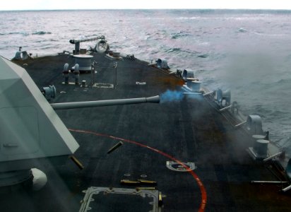 US Navy 100203-N-7058E-355 The littoral combat ship USS Freedom (LCS 1) fires multiple rounds from its Mk 110 57mm gun during combat systems testing off the Florida coast