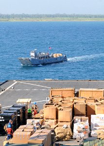 US Navy 100204-N-1082Z-031 Landing Craft Unit 1663 comes along side the amphibious dock landing ship USS Ashland (LSD 48) to receive supplies to assist with humanitarian and disaster relief operations