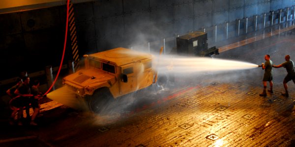 US Navy 100203-N-8607R-088 Marines wash vehicle aboard USS Bonhomme Richard