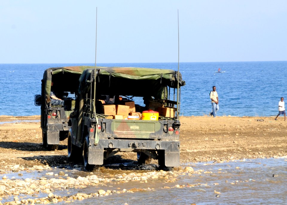 US Navy 100206-N-1092P-013 Vehicles from 22nd Marine Expeditionary Unit ransport supplies for Sailors working in Grand Goave, Haiti