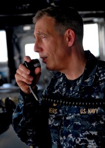 US Navy 100205-N-7653W-106 apt. Thomas Negus, commodore of Bataan Amphibious Relief Mission, speaks to Sailors about the Operation Unified Response mission over the 1MC aboard the amphibious dock landing ship USS Fort McHenry (