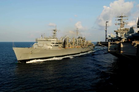 US Navy 100206-N-3038W-208 The Military Sealift Command fast combat support ship USNS Bridge (T-AOE 10) pulls alongside the aircraft carrier USS Nimitz (CVN 68) for a replenishment at sea