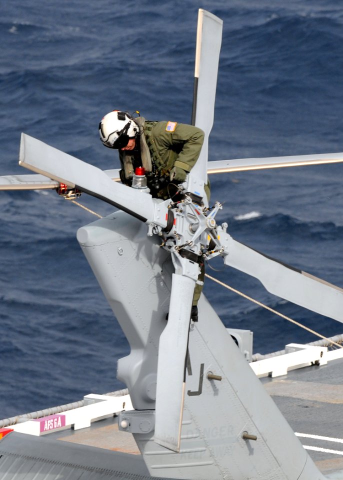 US Navy 100204-N-3885H-018 A pilot assigned to Helicopter Sea Combat Squadron (HSC) 6 conducts a pre-flight inspection on an MH-60S Sea Hawk helicopter aboard the aircraft carrier USS George H.W. Bush (CVN 77)