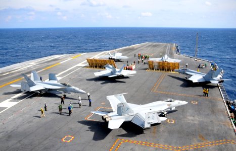 US Navy 100204-N-4774B-224 F-A-18 Super Hornets assigned to the Sunliners of Strike Fighter Squadron (VFA) 81 move into position aboard the Nimitz-class aircraft carrier USS Carl Vinson (CVN 70)