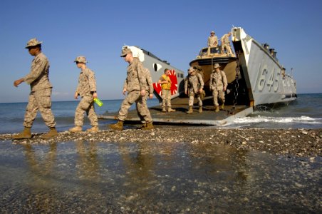US Navy 100203-N-8936G-077 Marines assigned to the 24th Marine Expeditionary Unit (24th MEU) disembark from Landing Craft Unit (LCU) 1645 to provide personnel and supplies to assist with humanitarian and disaster relief operati