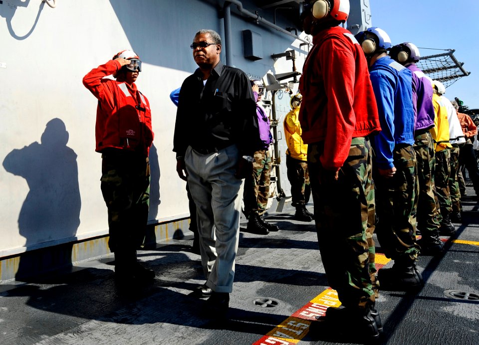 US Navy 100206-N-5345W-029 Haitian Prime Minister Jean-Max Bellerive receives honors from sideboys after arriving aboard the amphibious assault ship USS Bataan (LHD 5)