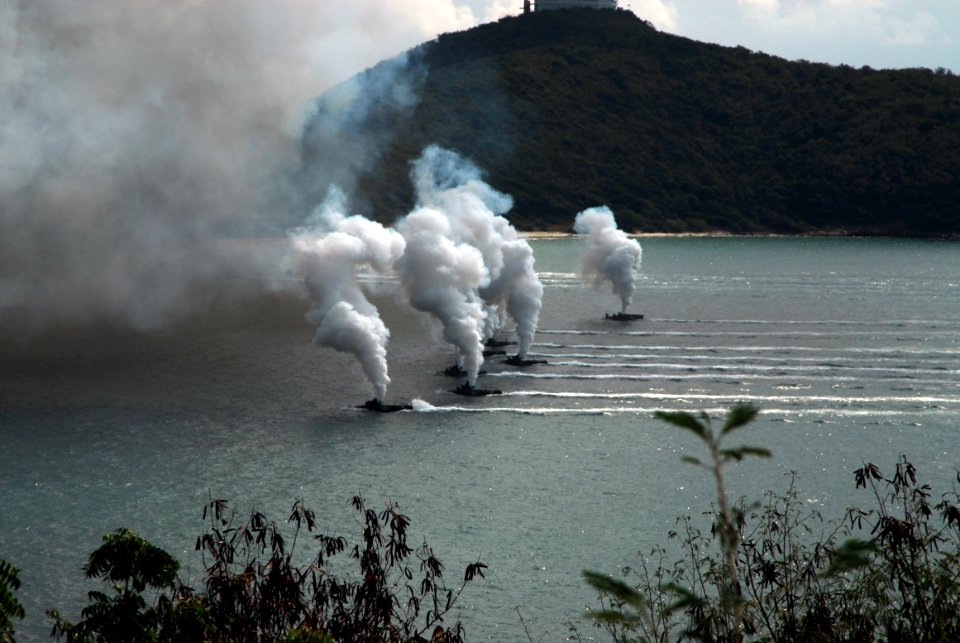 US Navy 100204-N-7843A-121 Republic of Korea amphibious assault vehicles release a smoke screen before hitting the beach during a Cobra Gold 2010 amphibious landing demonstration