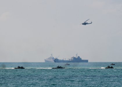 US Navy 100204-N-9950J-283 U.S. and Thai amphibious assault vehicles speed toward the beach during a simulated amphibious assault as part of exercise Cobra Gold 2010