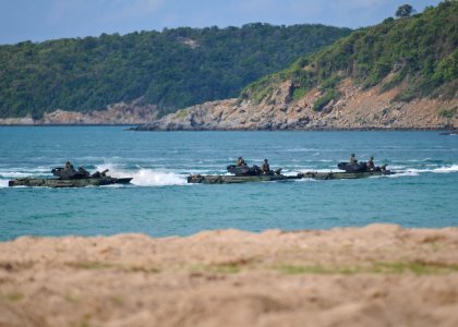 US Navy 100204-N-9950J-411 Amphibious assault vehicles assigned to Assault Craft Unit (ACU) 1, Det. Western Pacific, speed toward the beach during a simulated amphibious assault as part of exercise Cobra Gold 2010 photo