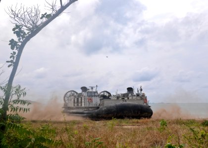 US Navy 100204-N-9950J-105 A landing craft, air cushion vehicle maneuvers on the beach during a simulated amphibious assault as part of exercise Cobra Gold 2010