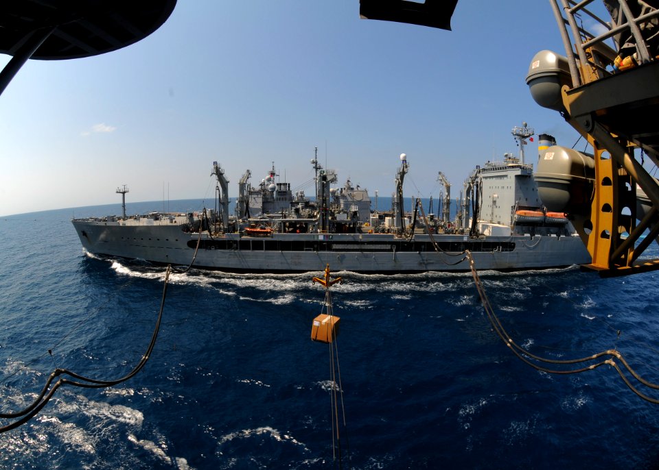 US Navy 100207-N-9950J-787 The forward-deployed amphibious assault ship USS Essex (LHD 2) receives supplies from the Military Sealift Command fleet replenishment oiler USNS Tippecanoe (T-AO 199)