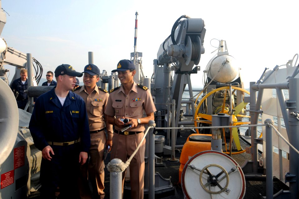 US Navy 100206-N-8335D-192 Ensign Kevin Lewman gives Royal Thai Navy officers a tour of the mine counter-measures ship USS Patriot (MCM 7) during exercise Cobra Gold 2010