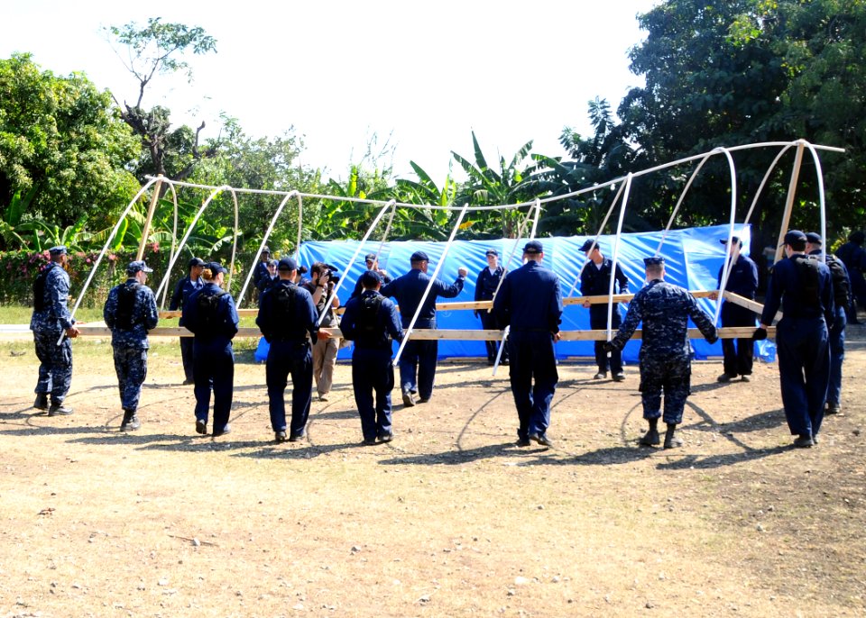 US Navy 100206-N-1092P-080 Sailors assigned to the amphibious assault ship USS Bataan (LHD 5) construct a temporary shelter in Grand Goave, Haiti