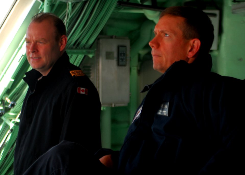 US Navy 100207-N-7058E-255 Cmdr. Randy Garner, Gold Crew commanding officer of the littoral combat ship USS Freedom (LCS 1), observes a surface gunnery exercise aboard Freedom