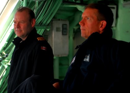 US Navy 100207-N-7058E-255 Cmdr. Randy Garner, Gold Crew commanding officer of the littoral combat ship USS Freedom (LCS 1), observes a surface gunnery exercise aboard Freedom