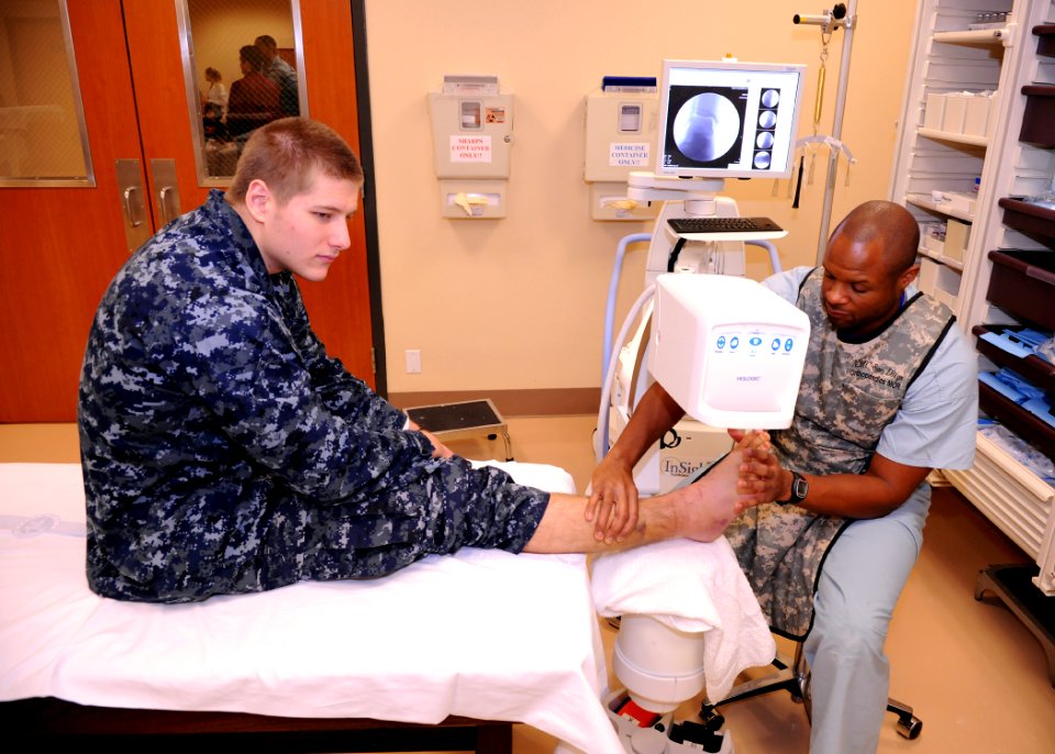 US Navy 100208-N-6326B-010 Aviation Boatswain's Mate (Handling) Airman Thomas E. Payne, assigned to the aircraft carrier USS Nimitz (CVN 68), has his fractured ankle evaluated using a bedside X-ray machine