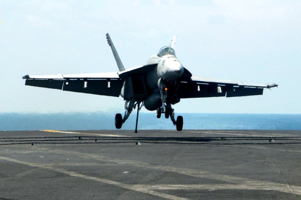US Navy 100206-N-3038W-688 An F-A-18E Super Hornet assigned to the Tophatters of Strike Fighter Squadron (VFA) 14 lands aboard the aircraft carrier USS Nimitz (CVN 68)