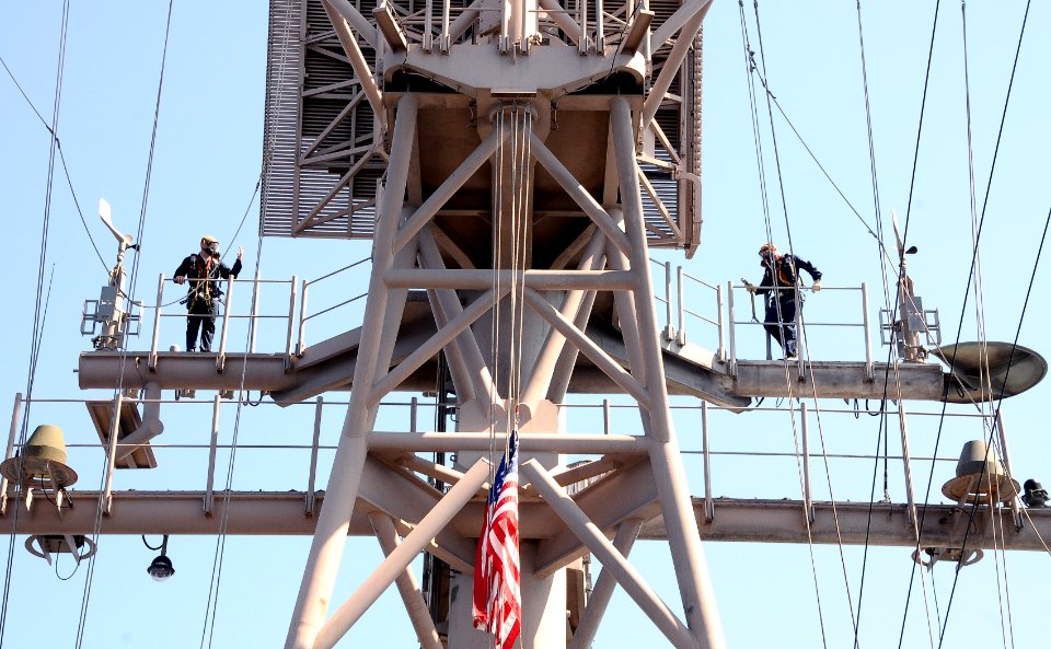 US Navy 100209-N-1831S-126 Interior Communications Electrician 2nd class Korey Bozeman and Interior Communications Electrician 2nd class Daniel Cordel perform maintenance aboard the multi-purpose amphibious assaults ship USS Ba