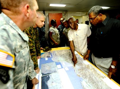 US Navy 100206-N-5345W-155 Haitian Prime Minister Jean-Max Bellerive listens to an explanation of relief efforrts