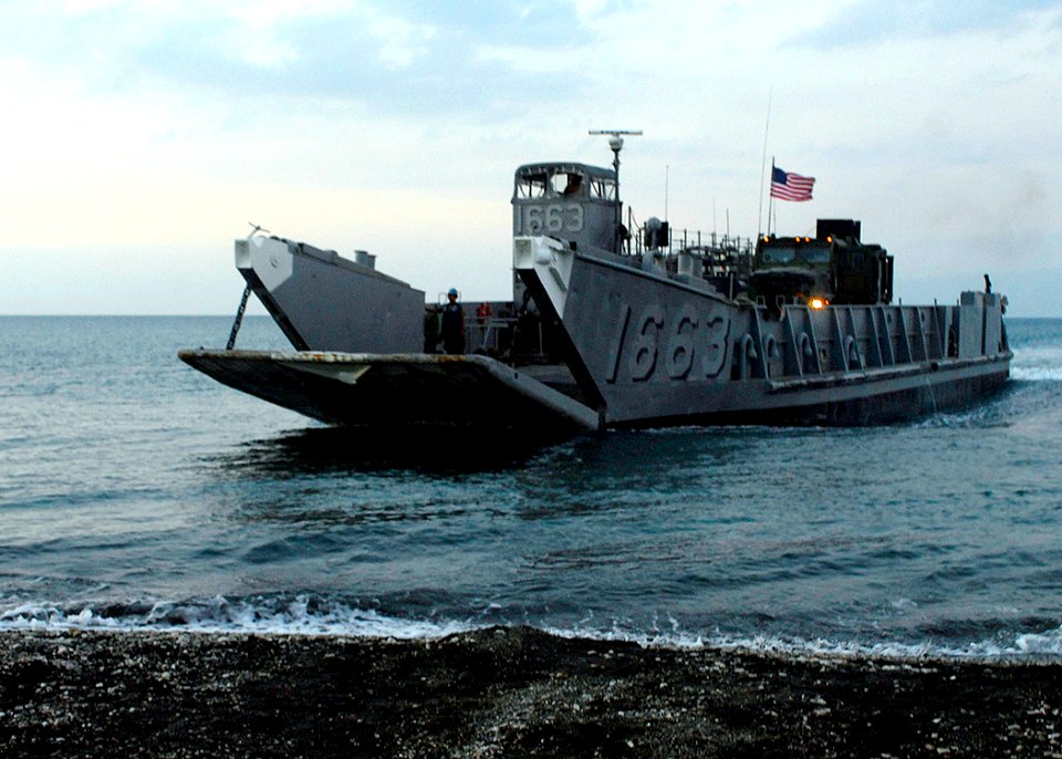 US Navy 100209-N-5244H-098 Assault Craft Utility 1663, assigned to Assault Craft Unit (ACU) 2, lowers its stern gate as it prepares to bring Sailors and Marines back to the amphibious dock landing ship USS Carter Hall (LSD 50)