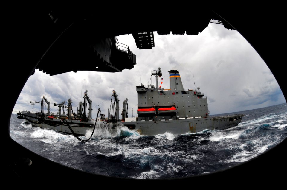 US Navy 100209-N-6006S-029 The Military Sealift Command fleet replenishment oiler USNS Leroy Grumman (T-AO 195) sends fuel lines over to the Nimitz-class aircraft carrier USS Carl Vinson (CVN 70) during a refueling-at-sea