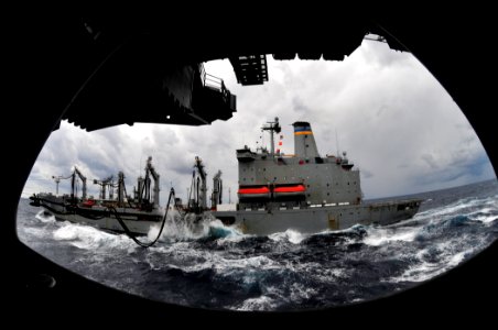 US Navy 100209-N-6006S-029 The Military Sealift Command fleet replenishment oiler USNS Leroy Grumman (T-AO 195) sends fuel lines over to the Nimitz-class aircraft carrier USS Carl Vinson (CVN 70) during a refueling-at-sea