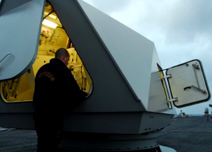 US Navy 100207-N-7058E-060 Gunner's Mate 1st Class Matthew Carlisle prepares the MK-110 57mm gun for a surface gunnery exercise aboard the littoral combat ship USS Freedom (LCS 1)