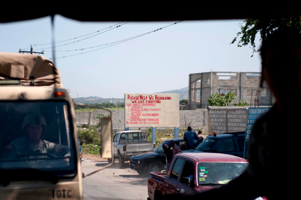 US Navy 100207-N-5712P-053 Earthquake survivors post signs around Haiti requesting aid after a 7.0 magnitude earthquake caused severe damage in and around Port-au-Prince, Haiti Jan. 12