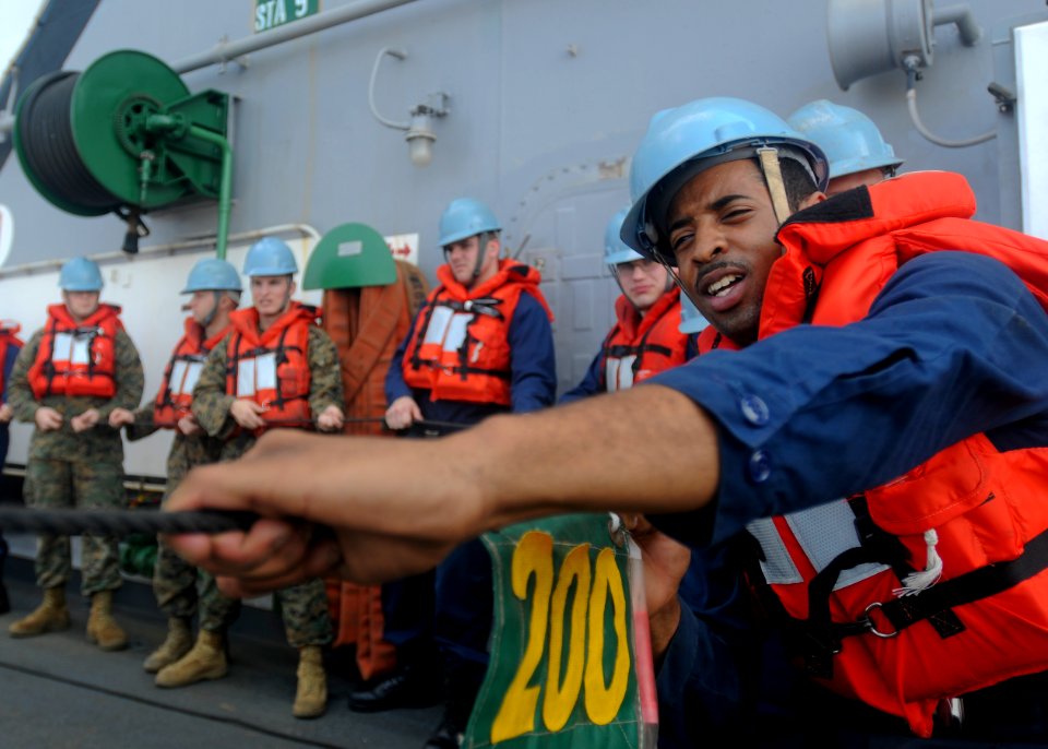 US Navy 100207-N-9950J-404 Seaman Recruit Brandon Cash steadies the phone and distance line aboard the forward-deployed amphibious assault ship USS Essex (LHD 2) during an underway replenishment