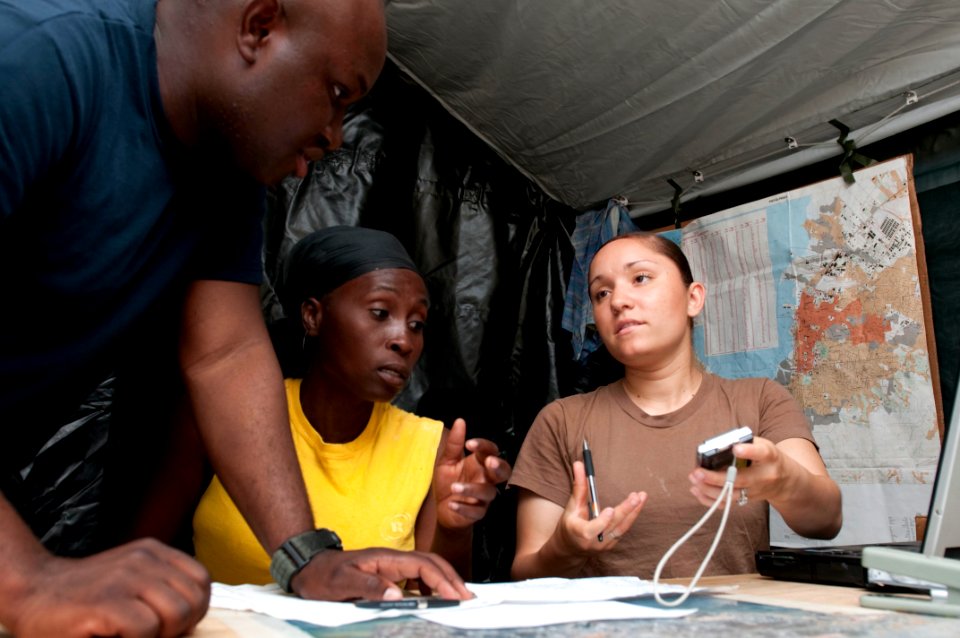 US Navy 100207-N-5712P-022 Sailors assist a Haitian citizen seeking aid from the Civil Military Operation Center