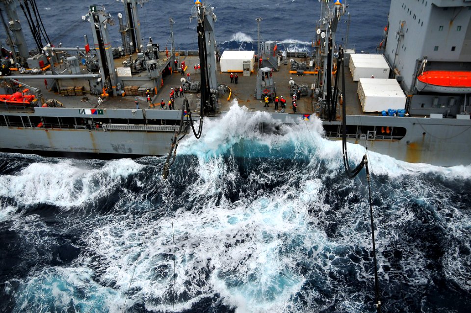 US Navy 100209-N-4774B-259 Fuel lines from the Military Sealift Command fleet replenishment oiler USNS Leroy Grumman (T-AO 195) are sent across cables to the Nimitz-class aircraft carrier USS Carl Vinson (CVN 70)