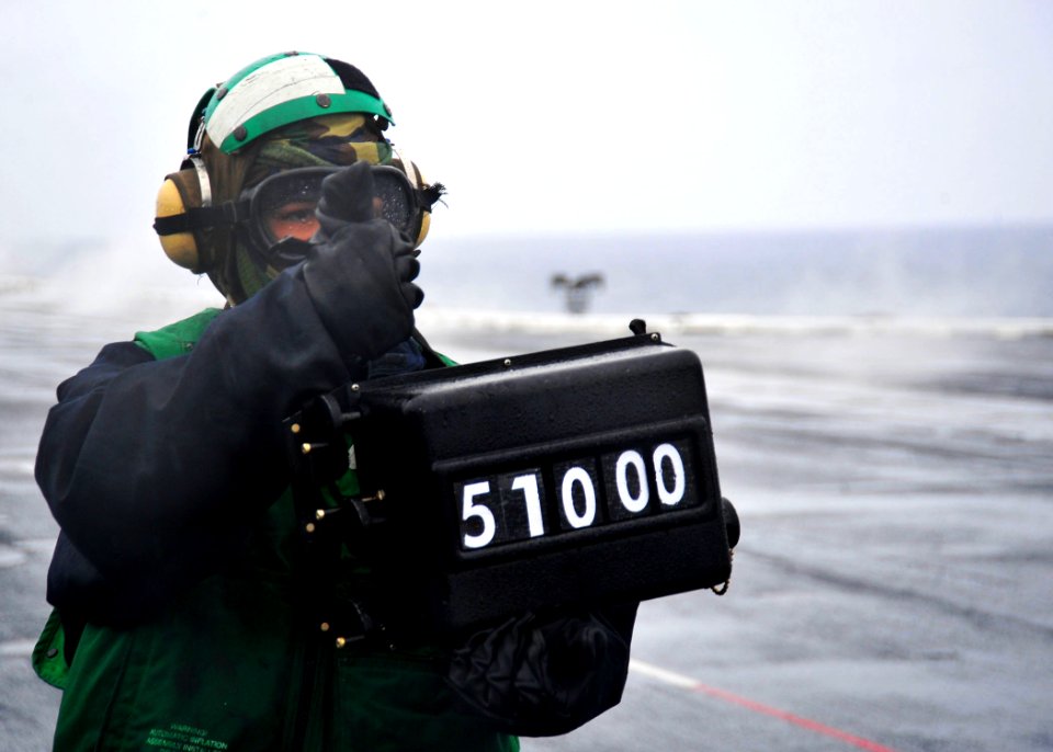 US Navy 100212-N-2953W-170 A weight board operator displays the weight of an FA-18 Super Hornet