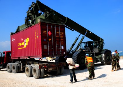 US Navy 100212-N-9643W-057 A Sailor monitors the transport of humanitarian supplies in Haiti
