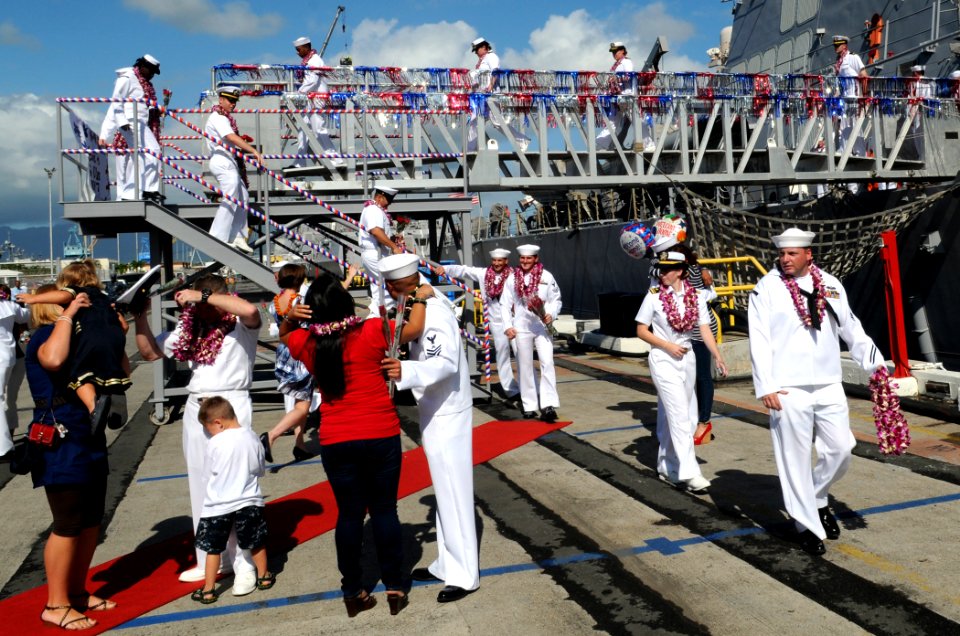 US Navy 100208-N-3666S-105 Sailors depart the guided-missile destroyer USS O'Kane (DDG 77) during the ship's homecoming to Joint Base Pearl Harbor