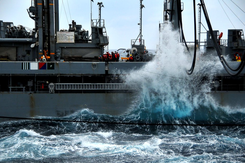 US Navy 100209-N-4774B-323 Waves crash against the hull of the Military Sealift Command fleet replenishment oiler USNS Leroy Grumman (T-AO 195) during a refueling-at-sea with the Nimitz-class aircraft carrier USS Carl Vinson (C