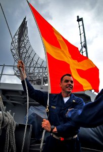 US Navy 100209-N-4774B-064 Senior Chief Quartermaster J.J. Meyers, from Bermudian, Pa., raises a Romeo signal flag aboard the Nimitz-class aircraft carrier USS Carl Vinson (CVN 70)