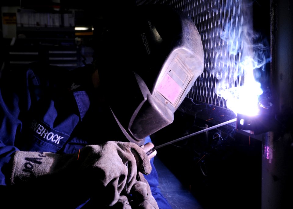 US Navy 100209-N-9116S-029 Hull Technician 3rd Class Joseph Vornbrock, replaces a locker latch in the machinery repair shop aboard the aircraft carrier USS George H.W. Bush (CVN 77)