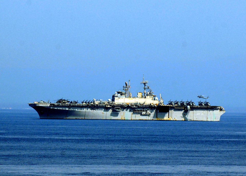 US Navy 100215-N-2000D-172 A helicopter lands on the flight deck of the multipurpose amphibious assault ship USS Bataan (LHD 5) as the ship conducts operations in the Caribbean Sea