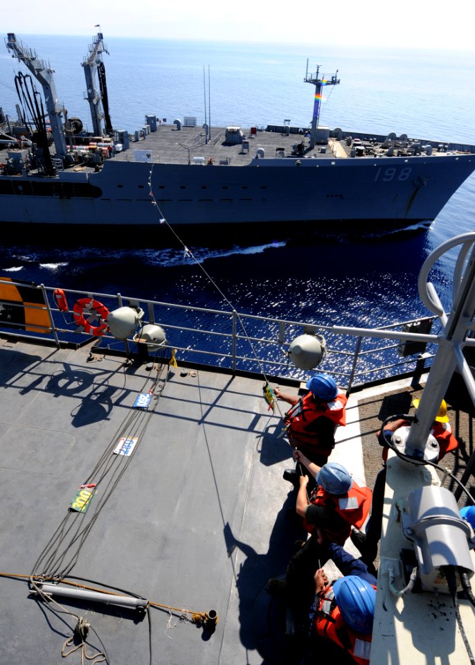 US Navy 100210-N-6676S-006 Sailors hold the phone-and-distance line aboard the amphibious dock landing ship USS Gunston Hall (LSD 44) during a refueling at sea with the Military Sealift Command fleet replenishment oiler USNS Bi